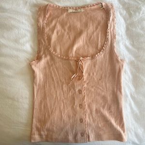 Doen tank with buttons and a tie